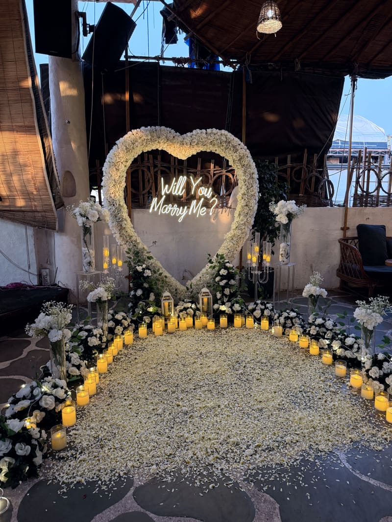 Proposal setup with candles and flowers by Cupid Vow, Chandigarh