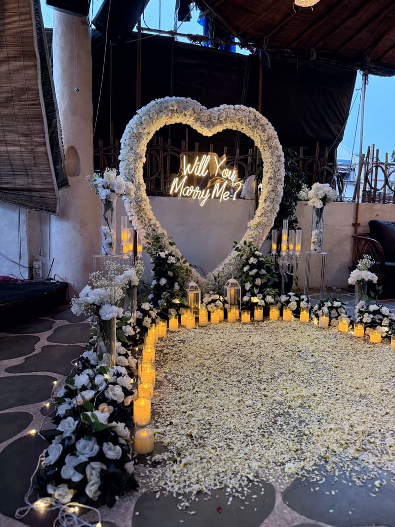 Proposal setup with candles and flowers by Cupid Vow, Chandigarh