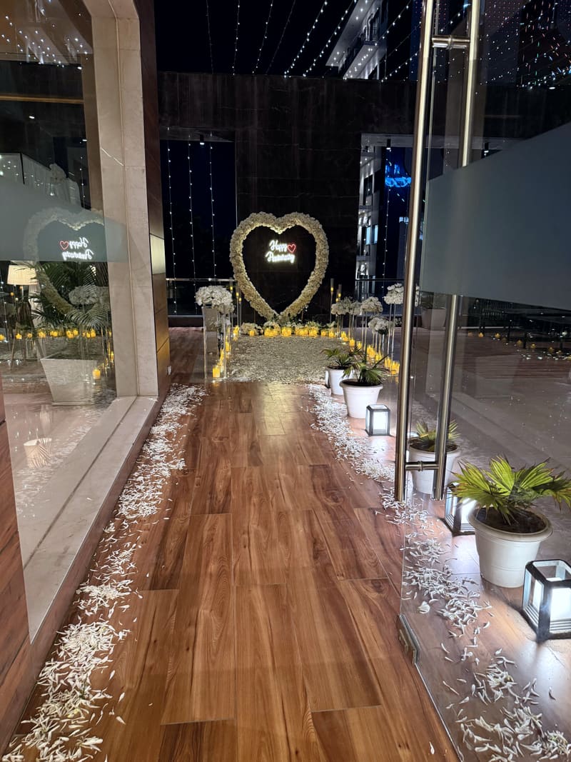 Proposal setup with candles and flowers by Cupid Vow, Chandigarh