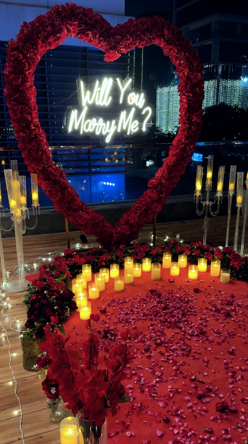 Proposal setup with candles and flowers by Cupid Vow, Chandigarh
