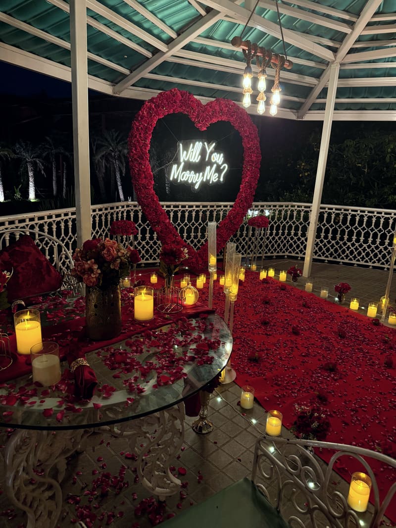 Proposal setup with candles and flowers by Cupid Vow, Chandigarh