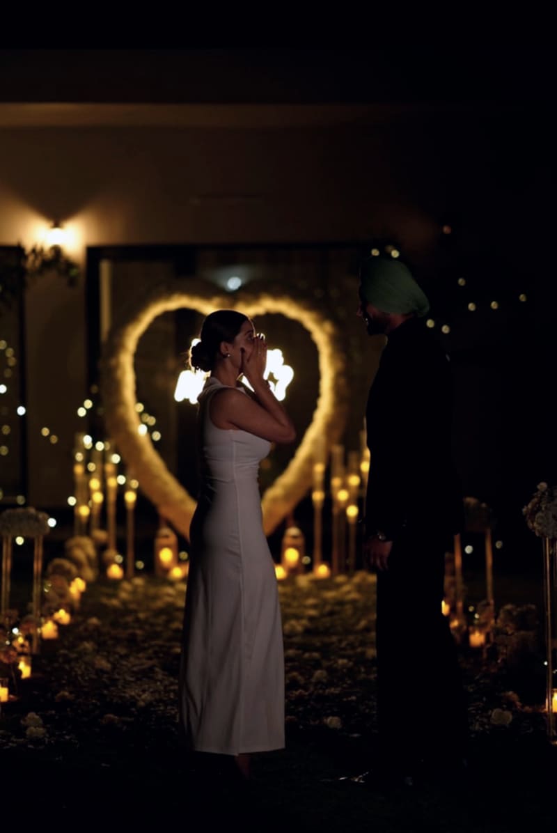 Couple in silhouette at a candlelit celebration setup in Chandigarh