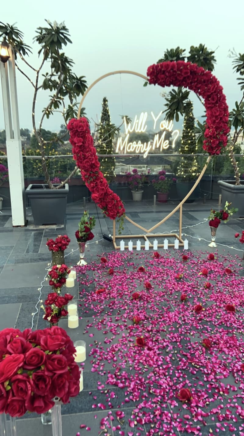 Proposal setup with candles and flowers by Cupid Vow, Chandigarh