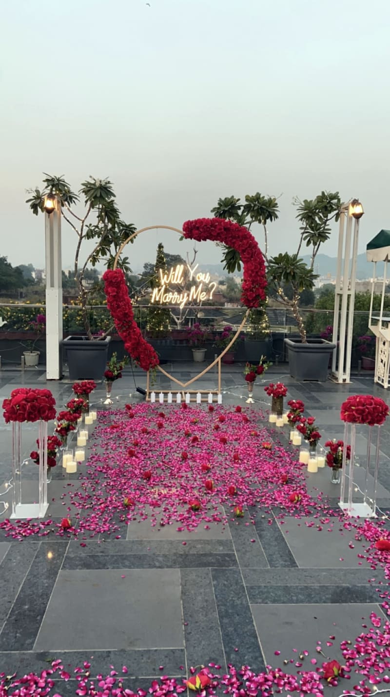 Proposal setup with candles and flowers by Cupid Vow, Chandigarh