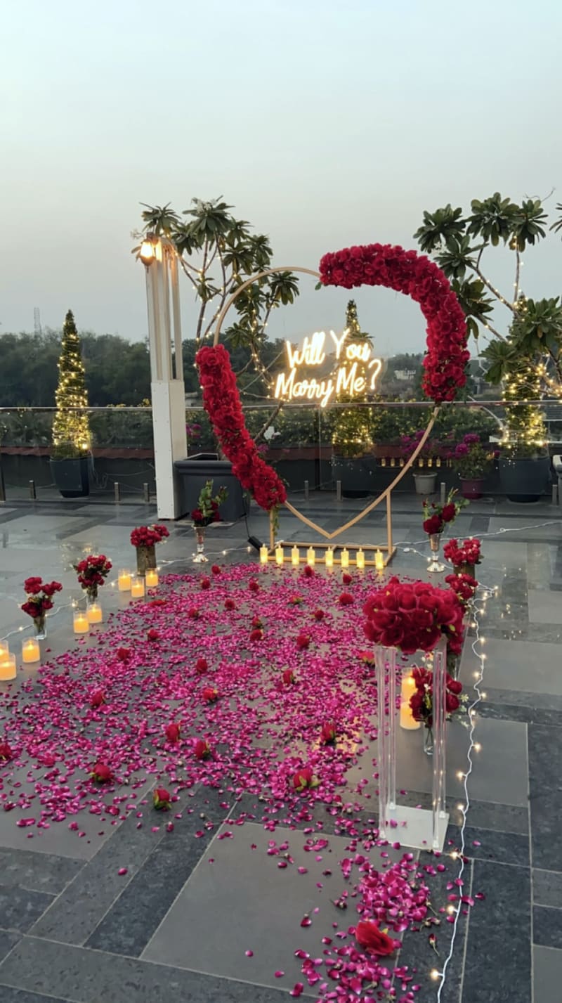 Proposal setup with candles and flowers by Cupid Vow, Chandigarh